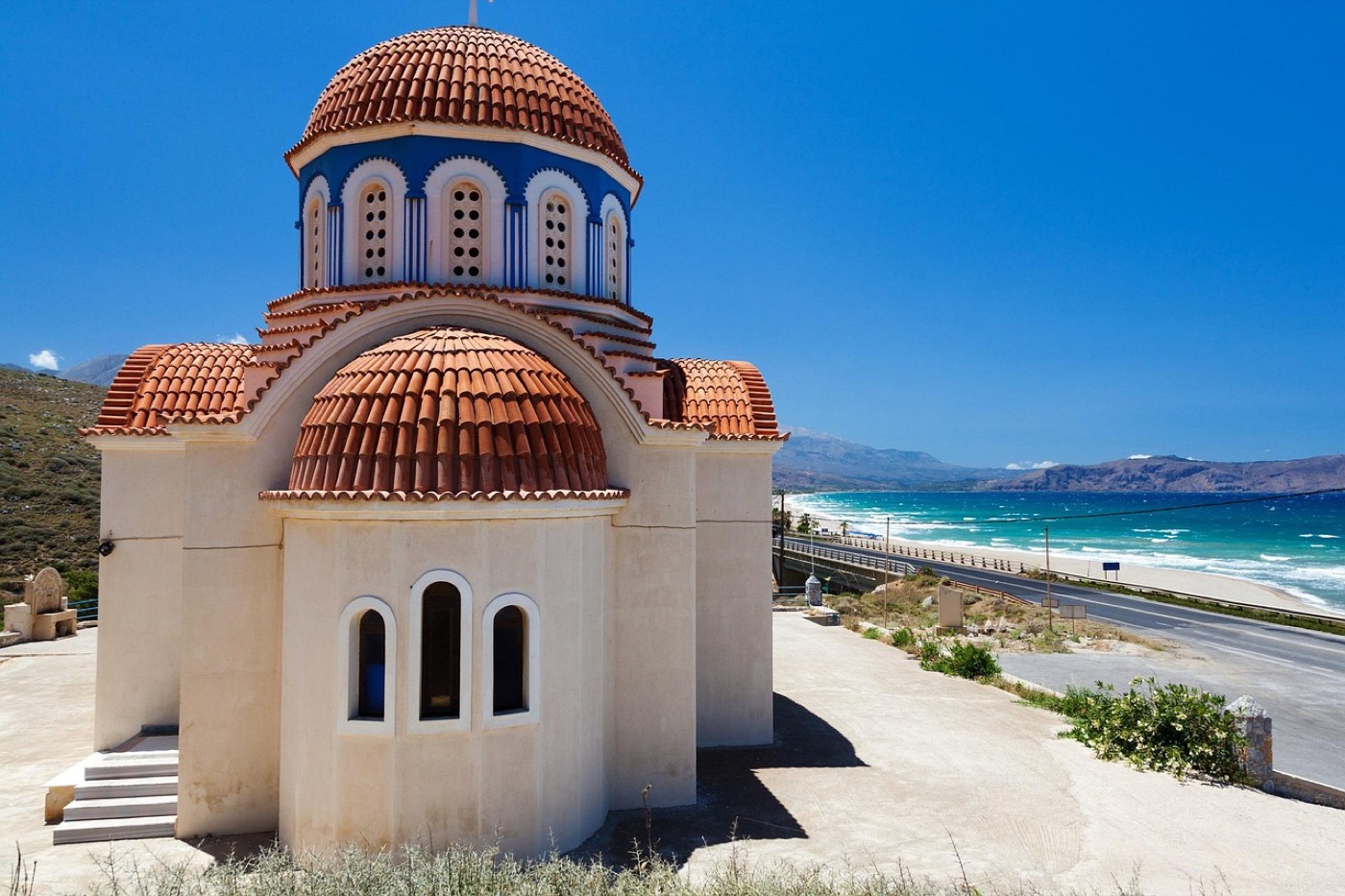 A domed Greek Orthodox church by the Cretan coast