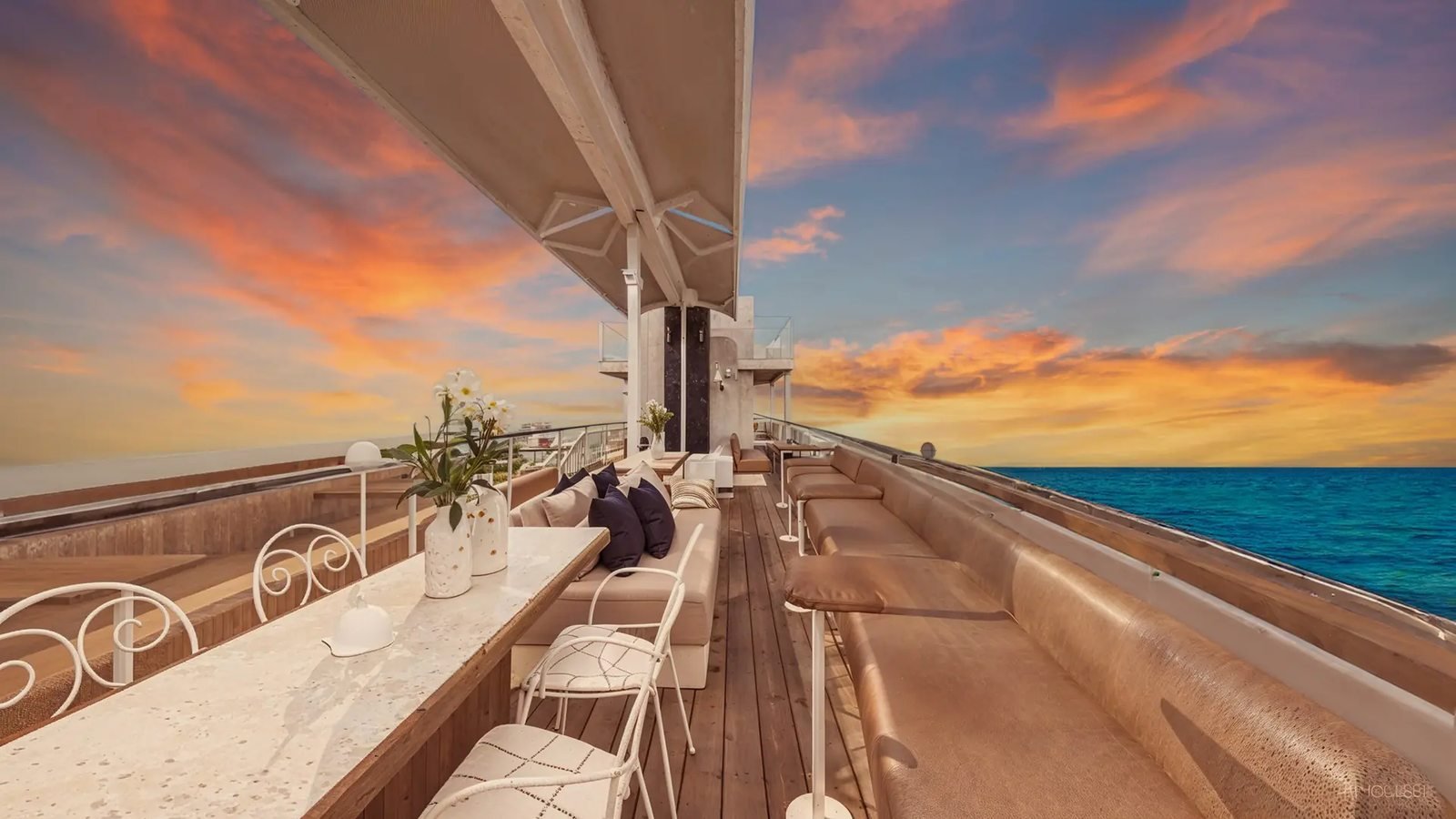 Sunset over the sea from the yacht's open deck