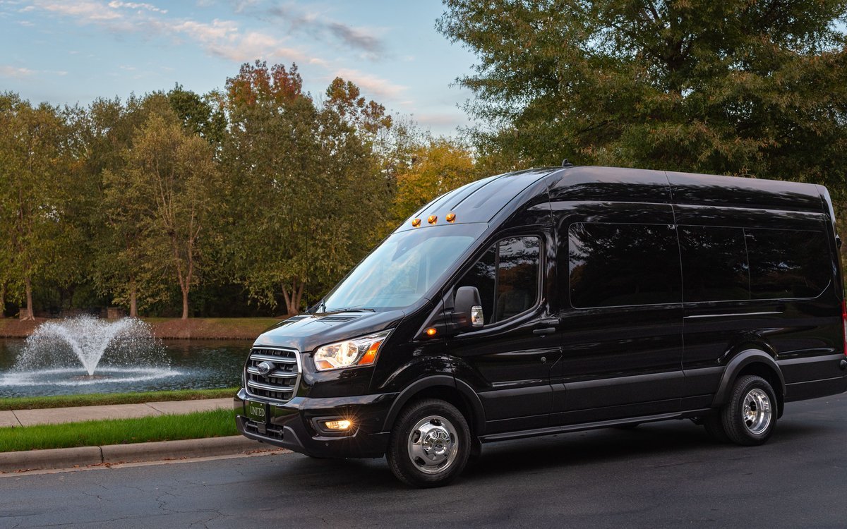 A sleek black shuttle van