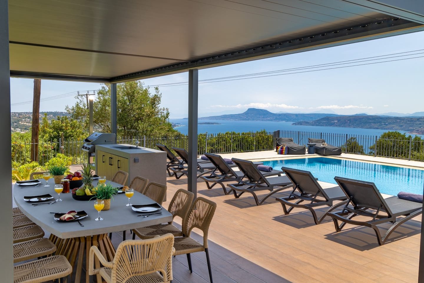The covered dining terrace looking out over the bay