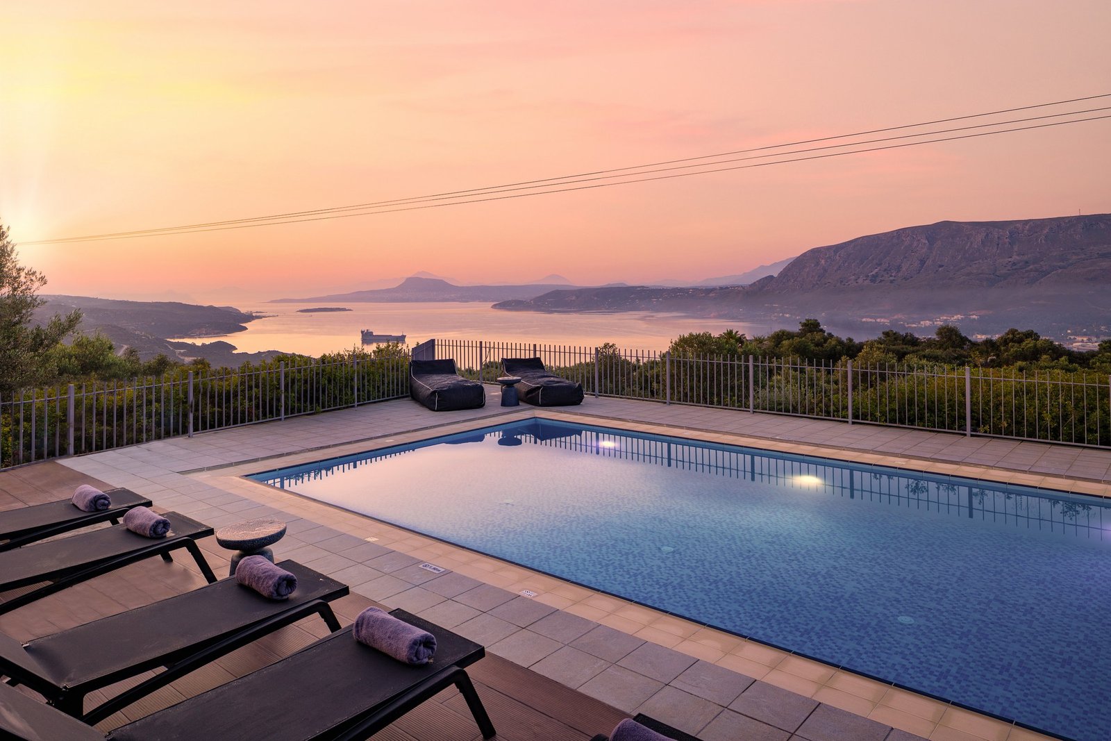 SeaSilia Villa pool at sunset over the bay of Chania